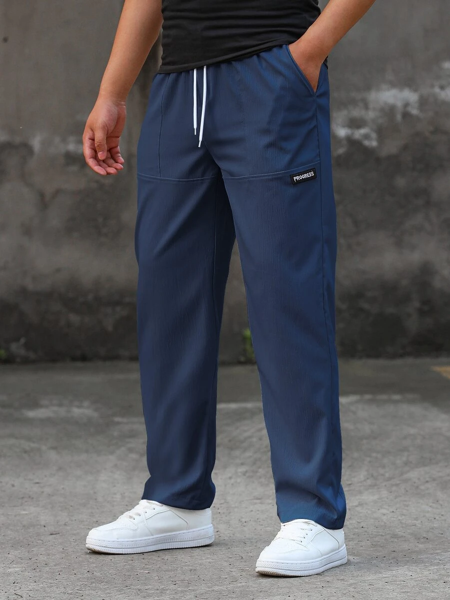 Manfinity Homme Quần dài nam màu xanh navy, cạp chun dây rút, túi hai bên, dáng rộng, size lớn, phong cách thường ngày năng động cho mùa thu và du lịch - Màu xanh hải quân - Xem 1