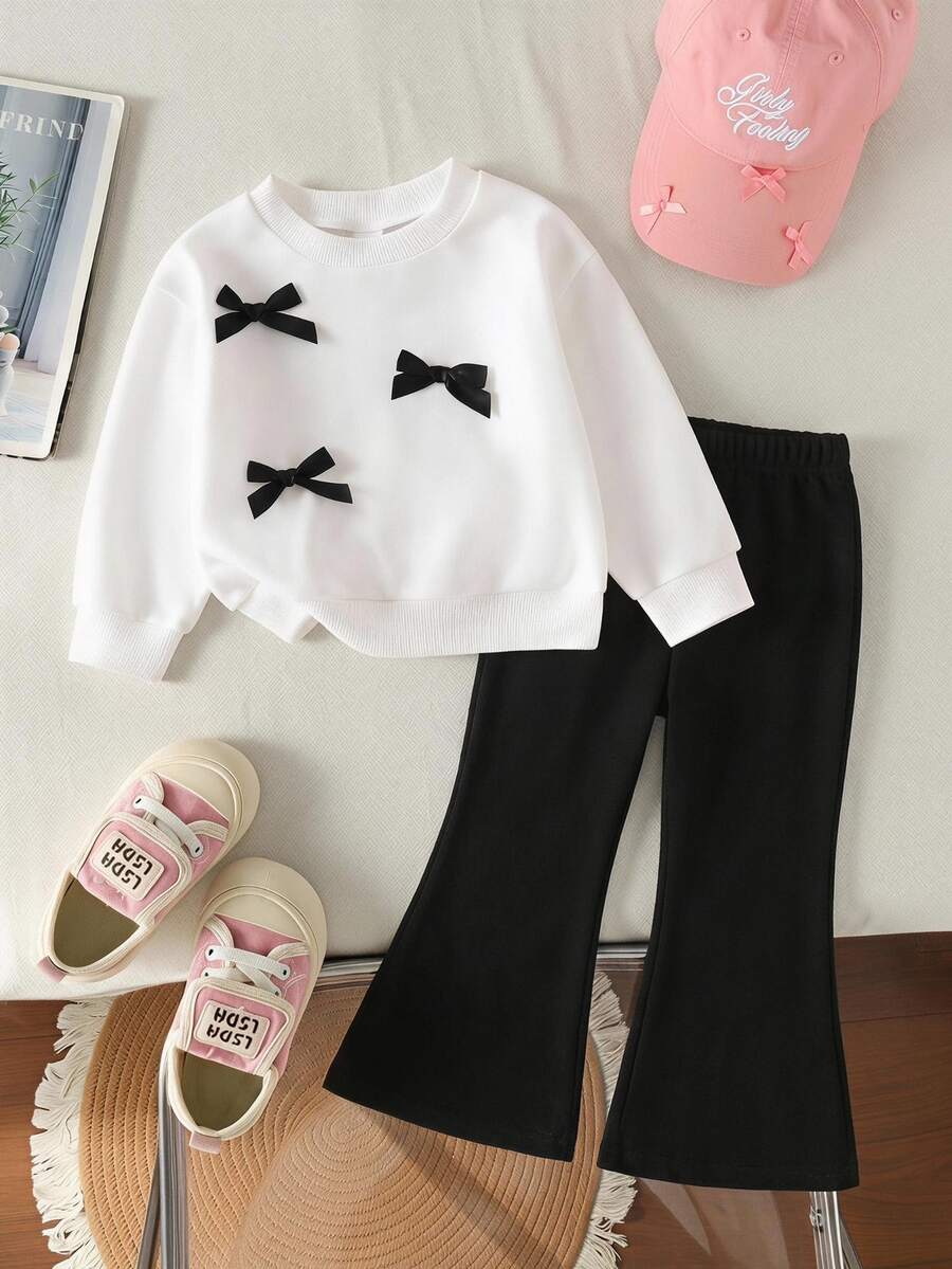 SHEIN Bộ đồ len dệt kim cổ tròn tay dài có nơ trang trí dễ thương cho bé gái và quần len ống loe lưng chun, giản dị và đáng yêu, mùa thu/đông - Đen và trắng - Xem 1