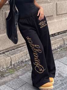 SHEIN 青少年女孩秋冬黑色寬腿休閒長褲，鬆緊抽繩腰頭，豹紋字母與復古標誌圖案，寬鬆版型，酷感配色，個性街頭風 - 黑色 - 查看 1