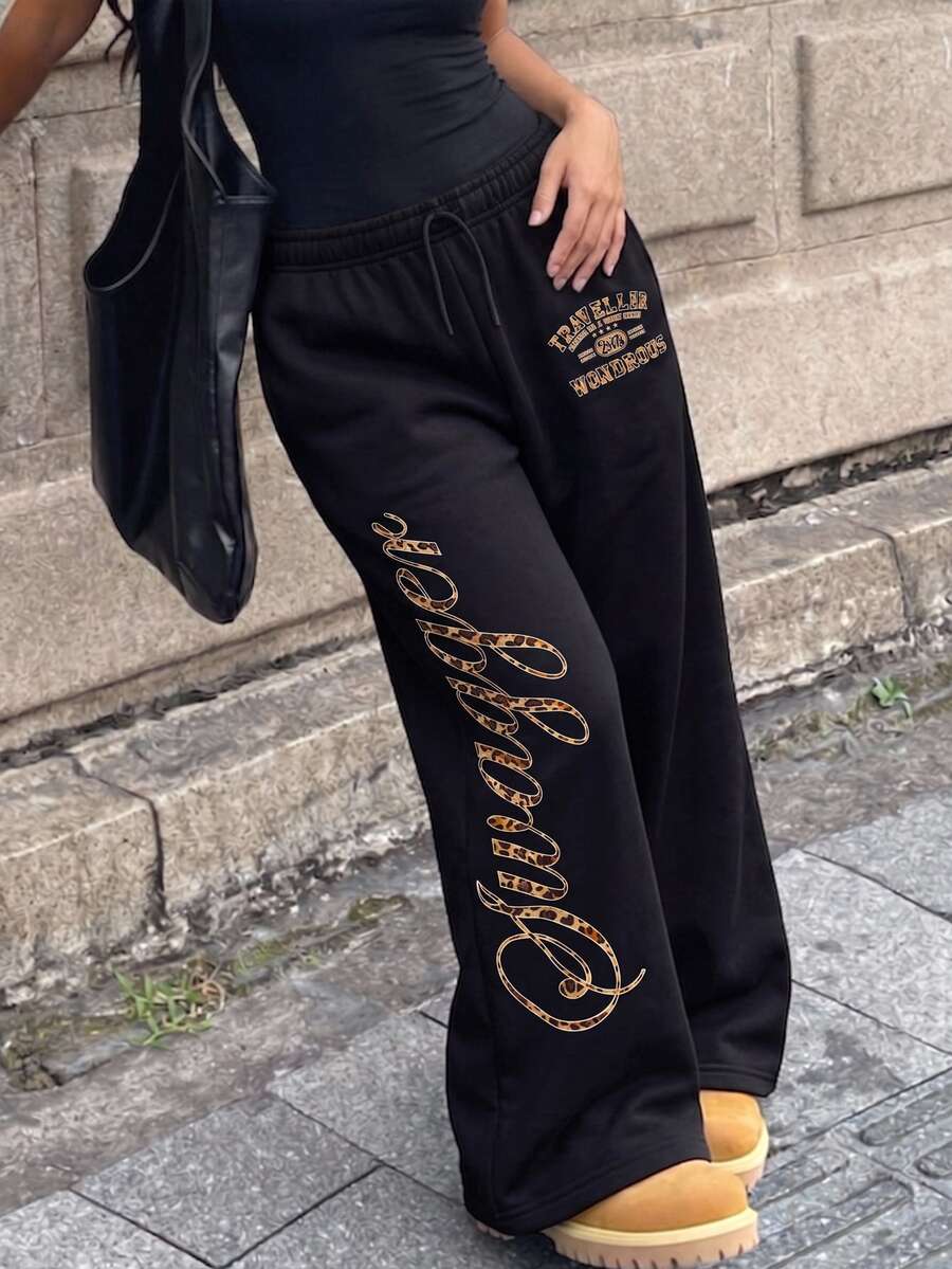 SHEIN 青少年女孩秋冬黑色寬腿休閒長褲,鬆緊抽繩腰頭,豹紋字母與復古標誌圖案,寬鬆版型,酷感配色,個性街頭風 - 黑色 - 查看 1