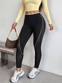 Dewbera Dewbera سروال رياضي ضيق للنساء بتصميم مخطط وألوان متباينة - أبيض وأسود - مشاهدة 5