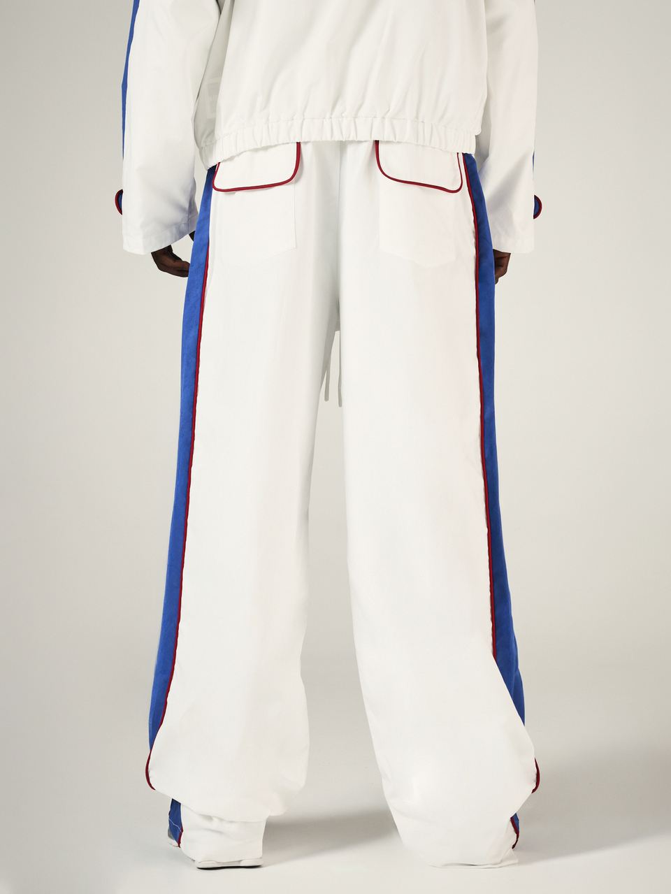 Wide Leg Track Pants With Blue Side Panels Red Contrast Piping Drawstring Waist And Patch Back Pockets Streetwear Style