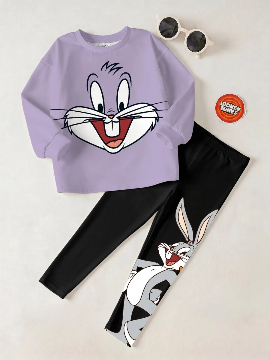 LOONEY TUNES X SHEIN طقم كاجوال للبنات الصغيرات ببلوزة رياضية بياقة دائرية مطبوعة برسومات كرتونية وبنطال ليقنز - أبيض - مشاهدة 1