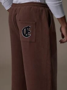 Emperor Men's Loose Brown Heavyweight Sweatpants With Elastic Drawstring Waist, Matching Color Drawstring, Adjustable Elastic Cuffs, And Back Patch Pocket With Letter Patch - Brown - View 6