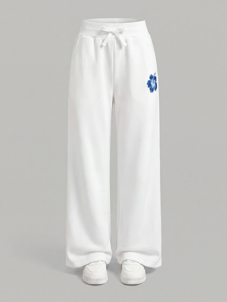 SHEIN Pantalón de chándal para niña preadolescente, blanco, holgado, de pierna ancha recta, con estampado floral de lirios, estilo denim grueso con forro térmico, para otoño/invierno - Blanco - Añade 5