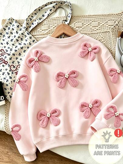 SHEIN Girls' Soft Light Pink Round Neck Sweatshirt With Faux 3D Plush Pearl Bow Decor, Loose Drop Shoulder Long Sleeve Pullover Top, Sweet Versatile Casual Outerwear For Spring And Autumn, Popular Style