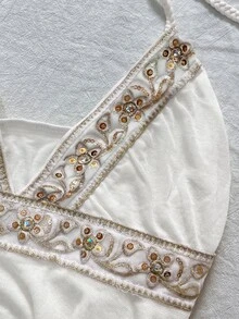 IslaSuriya Sequin Embroidered Ribbon Decor Asymmetric Hem Backless Halter Neck Top For Women - White - View 4