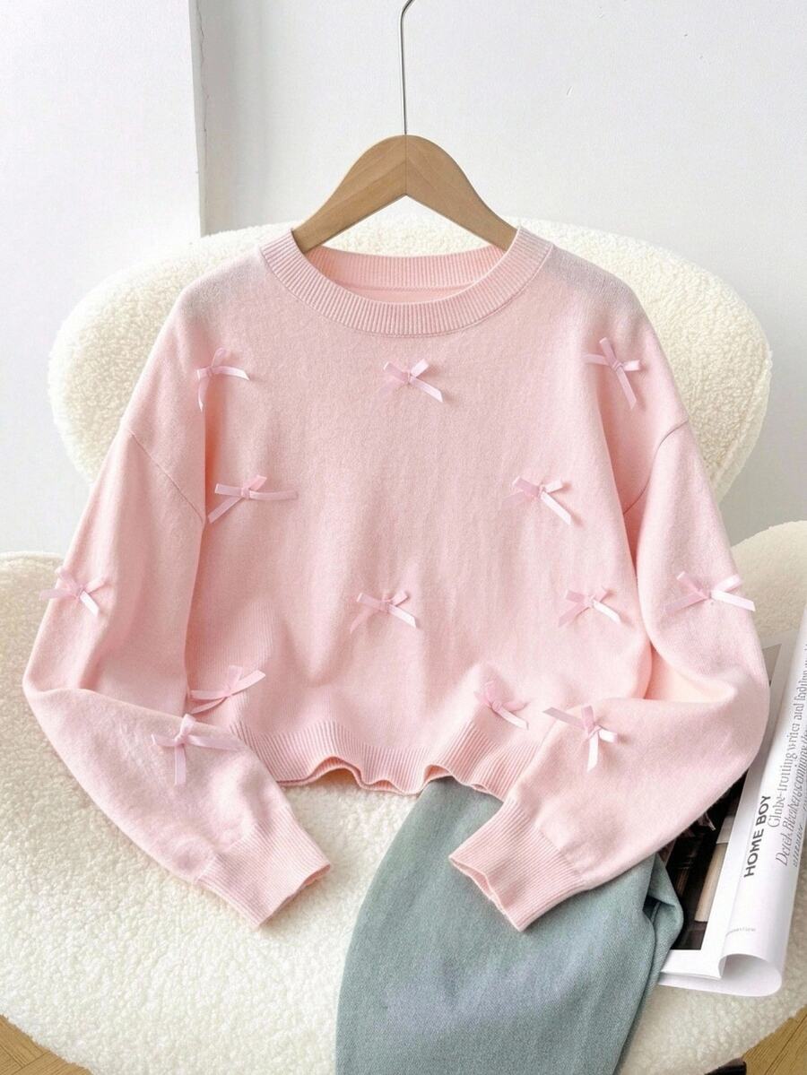 SHEIN 8-12 Years Old Girls Light Pink Round Neck Loose Drop Shoulder Short Knit Sweater With All-Over 3D Satin Bow Decor Long Sleeve Pullover Top, Soft And Sweet For Campus, Outings, Photos, Spring And Autumn - Pink - View 1