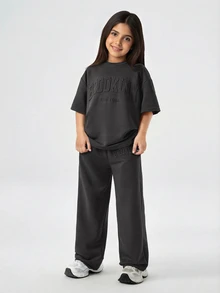 SHEIN Tween Girls' Loose Casual Minimalist Comfortable Round Neck Drop Shoulder Short Sleeve T-Shirt And Pants Set Summer Outfits - Black - View 1