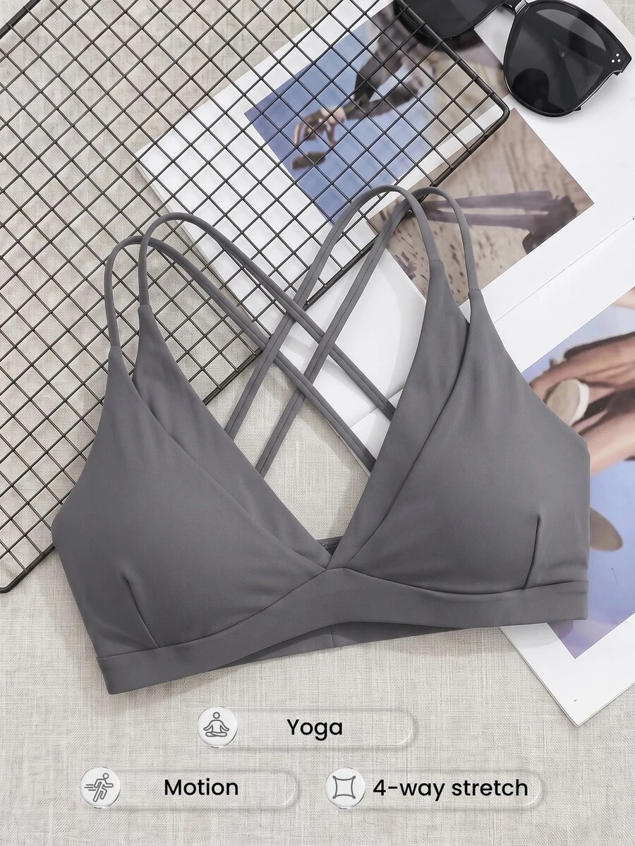 SHEIN Cheerettes حمالة صدر رياضية نسائية مقاس كبير بلون موحد بتصميم متقاطع من الخلف