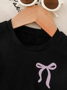 SHEIN 2件組女嬰夏季休閒甜美優雅街頭風黑色圓領T恤，胸前粉色蝴蝶結印花、袖口粉色緞帶蝴蝶結裝飾，搭配黑色長褲套裝，適合上學與日常穿著 - 黑色 - 查看 4