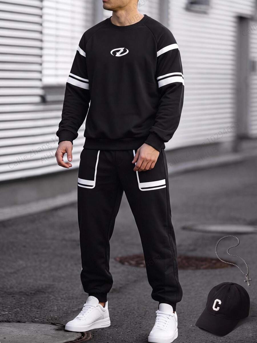 SHEIN 青少年男孩秋冬長袖慢跑褲2件套,黑色圓領上衣配雙白色條紋與圓形閃電Logo,搭配側邊雙白色條紋慢跑褲,打造完美呼應的簡約街頭運動造型 - 彩色 - 查看 1