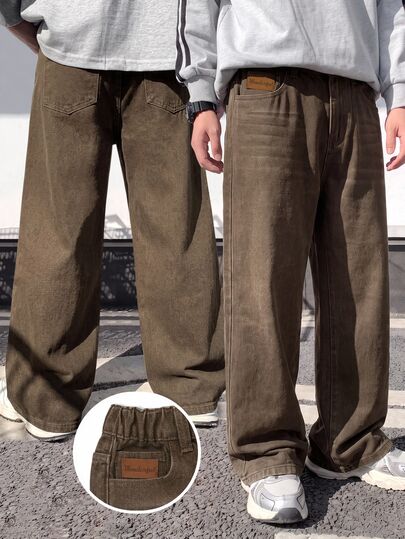 SHEIN Genkimix Kids Boys' Denim Long Pants, All Season, Soft, Cotton, Casual, Fashion, Versatile, Comfortable, Minimalist, Elastic Waistband, Classic Five-Pocket Design, Leather Patch Decoration, Loose Straight Wide Leg Fit, Brown Washed Denim Long Pants Suitable For Daily Wear And Vacation