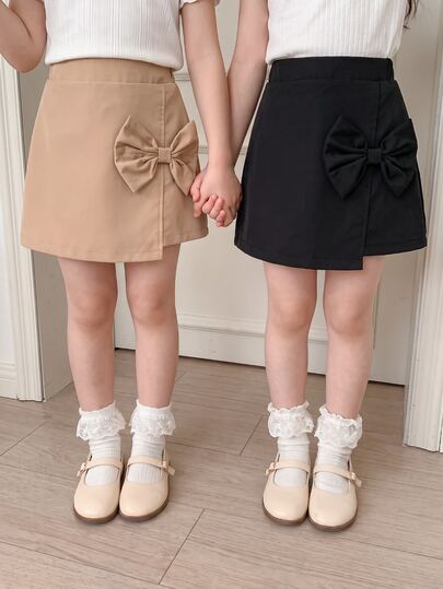 SHEIN Genkimix Kids Girls' Spring/Summer Skirt Set, Black And Khaki, Skirt Side Seam With 3D Bow Accessory, Sweet And Fashionable, Suitable For Outings, Parties And Sweet Style