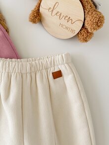 SHEIN 女童純色休閒直筒運動長褲，抓絨內裡保暖，適合秋冬穿著，1件隨機款 - 米色 - 查看 4