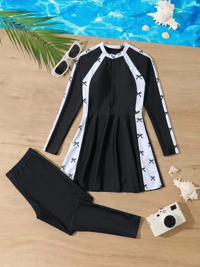 SHEIN Maillot de bain deux pièces pour filles préadolescentes, manches longues avec protection solaire, fermeture éclair, couleur unie noire, patchwork avec base blanche et imprimé nœud noir, pantalon long, convient pour la plage, les jeux, le bord de mer, les sorties décontractées, l'été