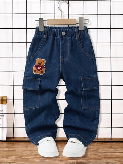 SHEIN Boys' Autumn Cotton Washed Versatile Fashion Casual Comfortable Loose Fit Denim Jeans With Elastic Waistband, Cargo Pockets, Embroidered Cartoon Towel Embroidery Decor, Blue Washed Loose Fit