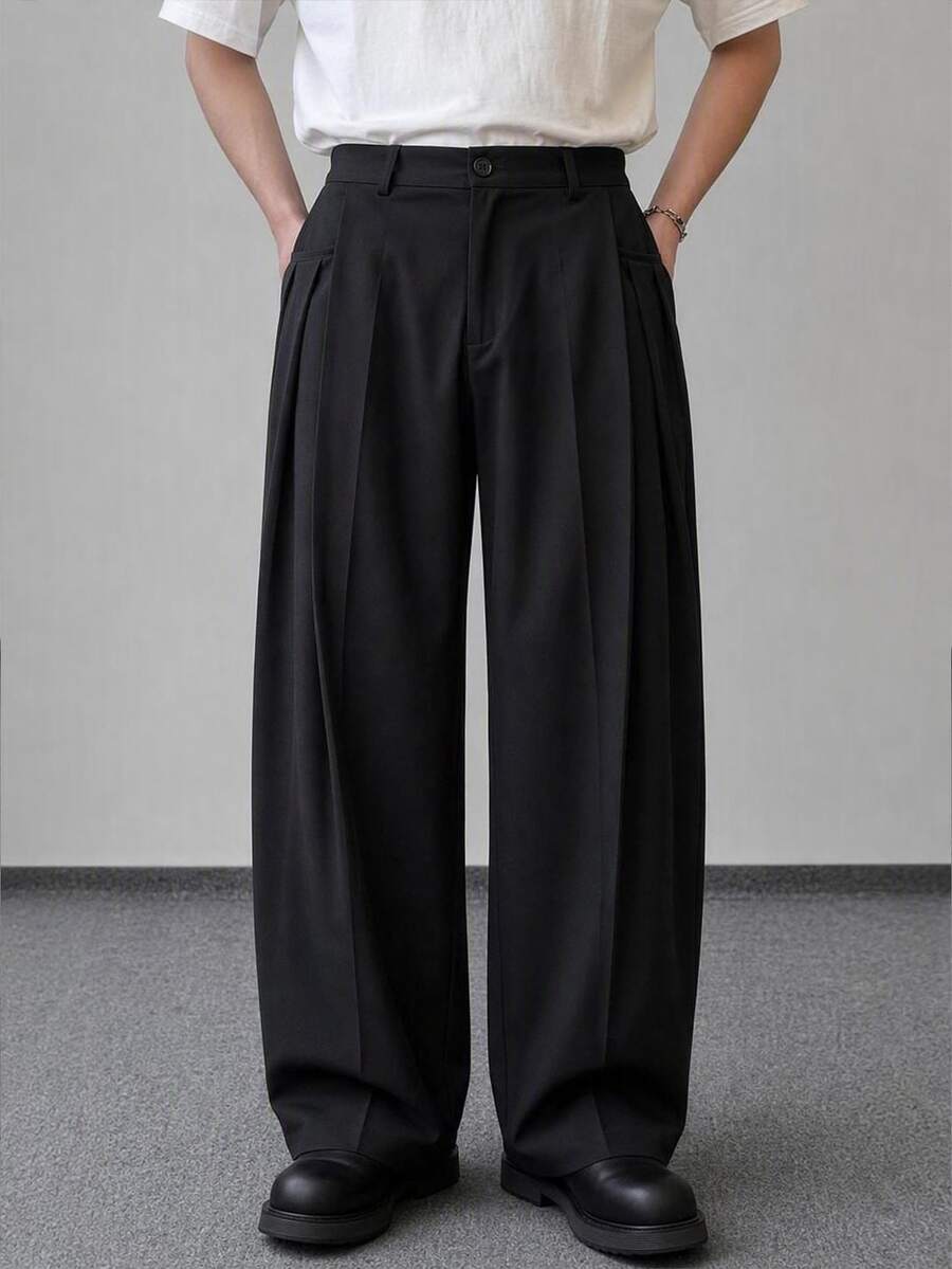 HIMLAND Men's Oatmeal High-Waisted Pleated Wide-Leg Trousers With Clean Front Drape. Structured Flowing Silhouette In Mid-Weight Suiting Blend. Black Pants - Black - View 1