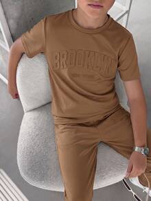 SHEIN 2pcs/Set Tween Boys' Brown Summer Casual City Break College Style Big Letter Embossed Graphic Round Neck Short Sleeve T-Shirt And Pants Sports Set - Coffee Brown - View 5