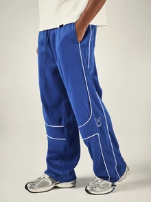 PLAYBOY X SUMWON Bunny Wide Leg Track Pants With White Contrast Piping Drawstring Waist Patch Pockets Elastic Ankle - Blue - View 1