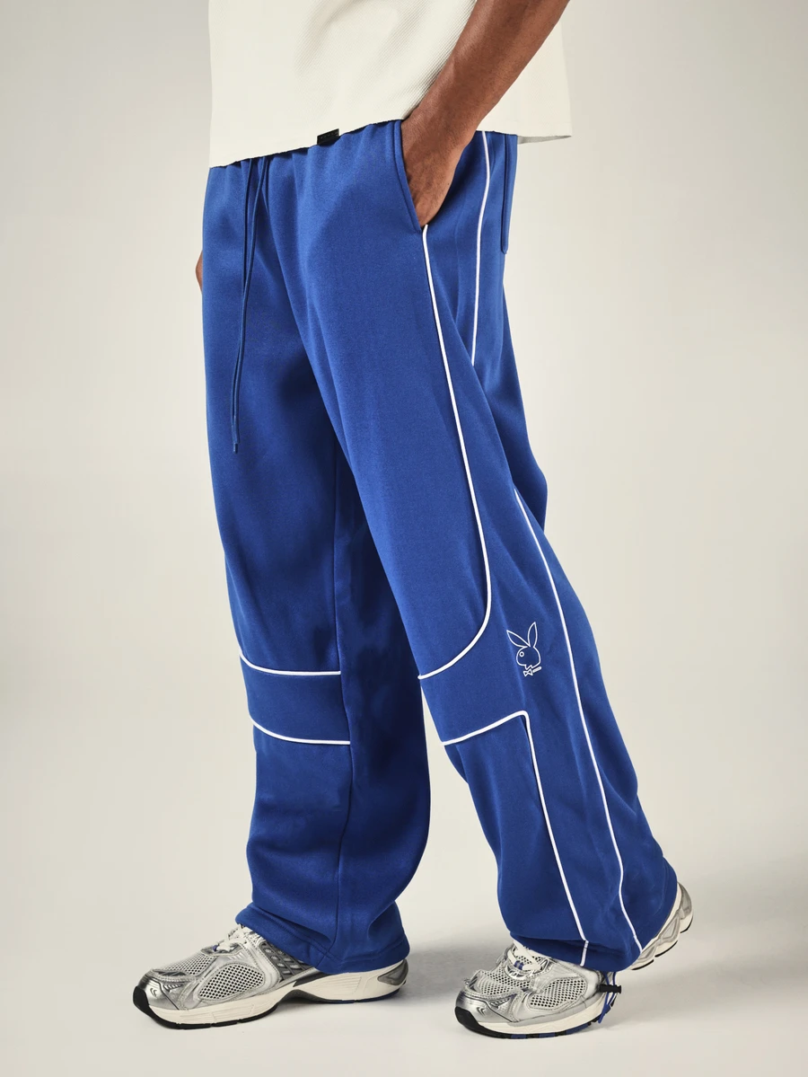 PLAYBOY X SUMWON Bunny Wide Leg Track Pants With White Contrast Piping Drawstring Waist Patch Pockets Elastic Ankle - Blue - View 1