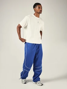 PLAYBOY X SUMWON Bunny Wide Leg Track Pants With White Contrast Piping Drawstring Waist Patch Pockets Elastic Ankle - Blue - View 3