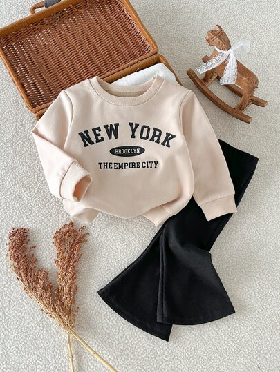 SHEIN Baby Girl 0-3y Spring/Autumn Apricot Letter Print Long Sleeve Top And Black Flared Pants 2-Piece Set, Cute Comfortable Minimalist Style, Suitable For Indoor And Outdoor Activities
