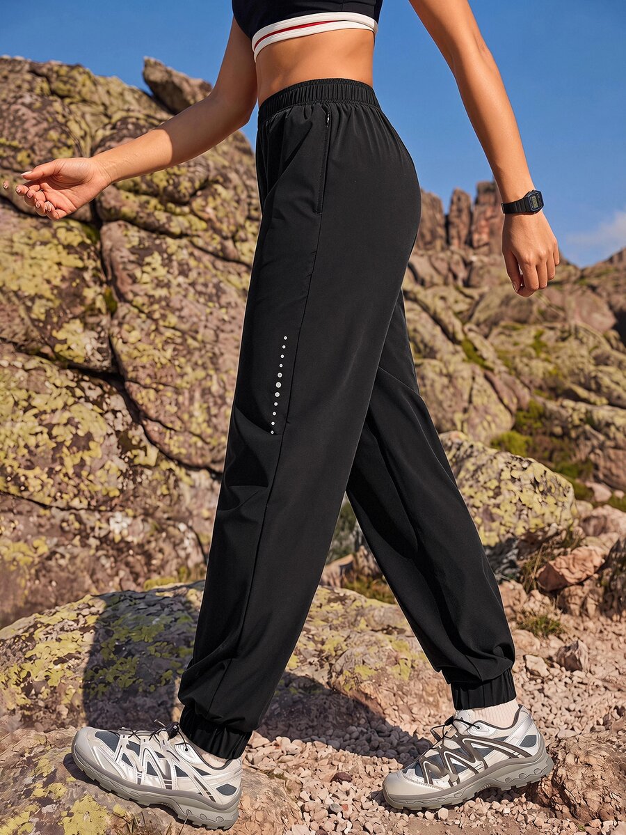 Exploreva Exploreva Women's Elastic Waist Pockets Loose Outdoor Running Pants - Black - View 1