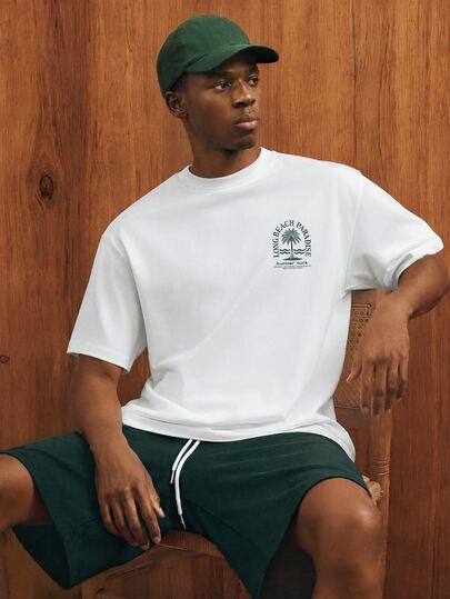 Manfinity Joysei Bộ đồ nam thường ngày in hình cây dừa, gồm áo len trắng ôm sát và quần short dệt màu xanh lá cây, 2 món, thích hợp cho các chuyến đi chơi mùa hè.