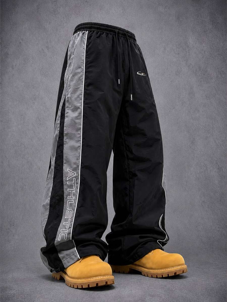 Manfinity Denimwave Men Loose Fit Track Pants Nylon Fabric Quick Dry Contrast Side Strip Letter Print Drawstring Waist Adjustable Hem Windbreaker Jogger Street Trousers - Black - View 1