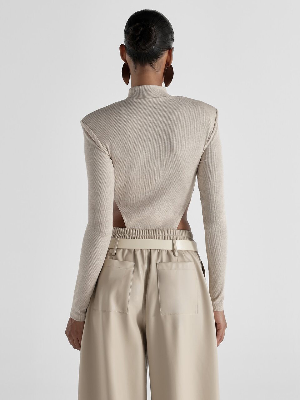 KSTM Ribbed Knit Mock Neck Long Sleeve Bodysuit With Dramatic Side Cut-Out And Structured Shoulder Detail