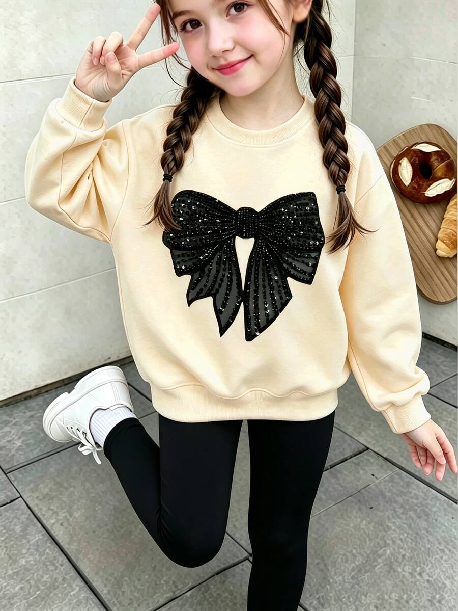 Tween Girls Crewneck Sweatshirt, Faux Sequin Black Bow Graphic Long Sleeve Pullover, Sweet Casual Autumn Tops - Apricot - View 1
