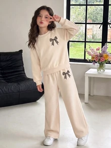 SHEIN Bộ 2 món áo nỉ cổ tròn lót lông cừu và quần ống rộng cho bé gái tween, họa tiết nơ da báo màu be, áo chui đầu dáng rộng, trang phục thu đông - Màu be - Xem 4