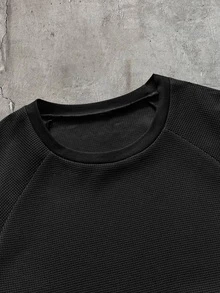 AXEPEAK Men's Long Sleeve Crew Neck T-Shirt, Black And White Color Block, Handwritten English Print, Loose Fit - Black - View 7