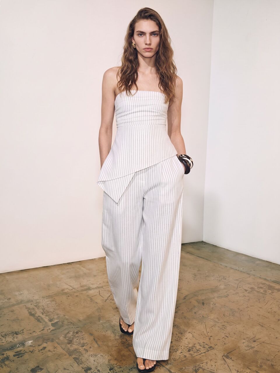 Anewsta New Spring/Summer White Base Fine Vertical Striped Bandeau Set, Urban Women's Ruched Asymmetrical Top And High-Waisted Pleated Wide-Leg Pants Two Pieces Set, Relaxed Old Money Style, Urban Vacation, Cool Atmosphere, Suitable For Commuting, Dating, Gathering, Travel, Vacation, Store Visiting, Light Social Occasions