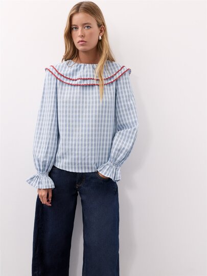 Nöista Women Blouse In Checks Blue Fabric, With Contrast Red On The Front And Back Neck.Ruffle Cuff. Blouse To Elevate The Everyday Looks On The Fall Winter