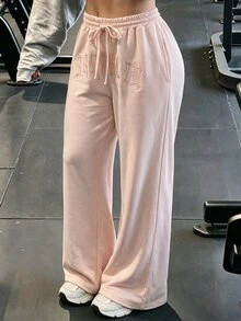 SHEIN EZwear بنطلون رياضي نسائي وردي فاتح بتطريز وتطبيقات مطرزة وخصر مطاطي برباط واسع الساق بطول الأرض للاستخدام اليومي والسفر والمطار والصيف والملابس الرياضية - وردي - مشاهدة 1