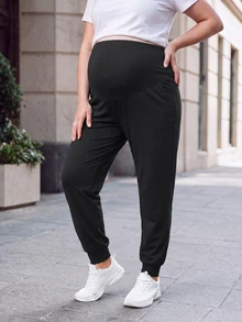 SHEIN بنطلون محبوك مقاس كبير للحوامل مريح للمنزل والرياضة، بحزام خصر مطاطي قابل للتعديل ودعم للبطن، بقصة ساق مدببة وجيوب، باللون الأسود - الأسود - مشاهدة 1