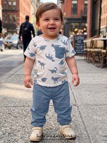 Cozy Pixies Baby Boy Cartoon Dinosaur Pattern Decorative Pocket Crew Neck Short Sleeve Pullover Top Elastic Waist Cuffed Long Pants 2-Piece Set - Blue - View 1