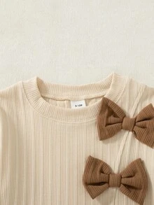SHEIN Baby Girl Sweet & Cool Contrast Color Bow Decor Comfortable Asymmetrical Ribbed Light Apricot Long Sleeve Top + Brown Flared Long Pants Set, Autumn/Winter Stylish 2-Piece Outfit - Multicolor - View 5