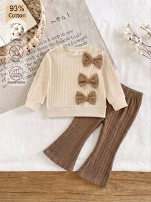 SHEIN Baby Girl Sweet & Cool Contrast Color Bow Decor Comfortable Asymmetrical Ribbed Light Apricot Long Sleeve Top + Brown Flared Long Pants Set, Autumn/Winter Stylish 2-Piece Outfit - Multicolor - View 3