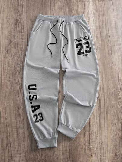 Manfinity Joysei Pantalones de chándal casuales con cordón en la cintura, bolsillos y diseño gráfico de letras, para hombres de talla grande, para rave