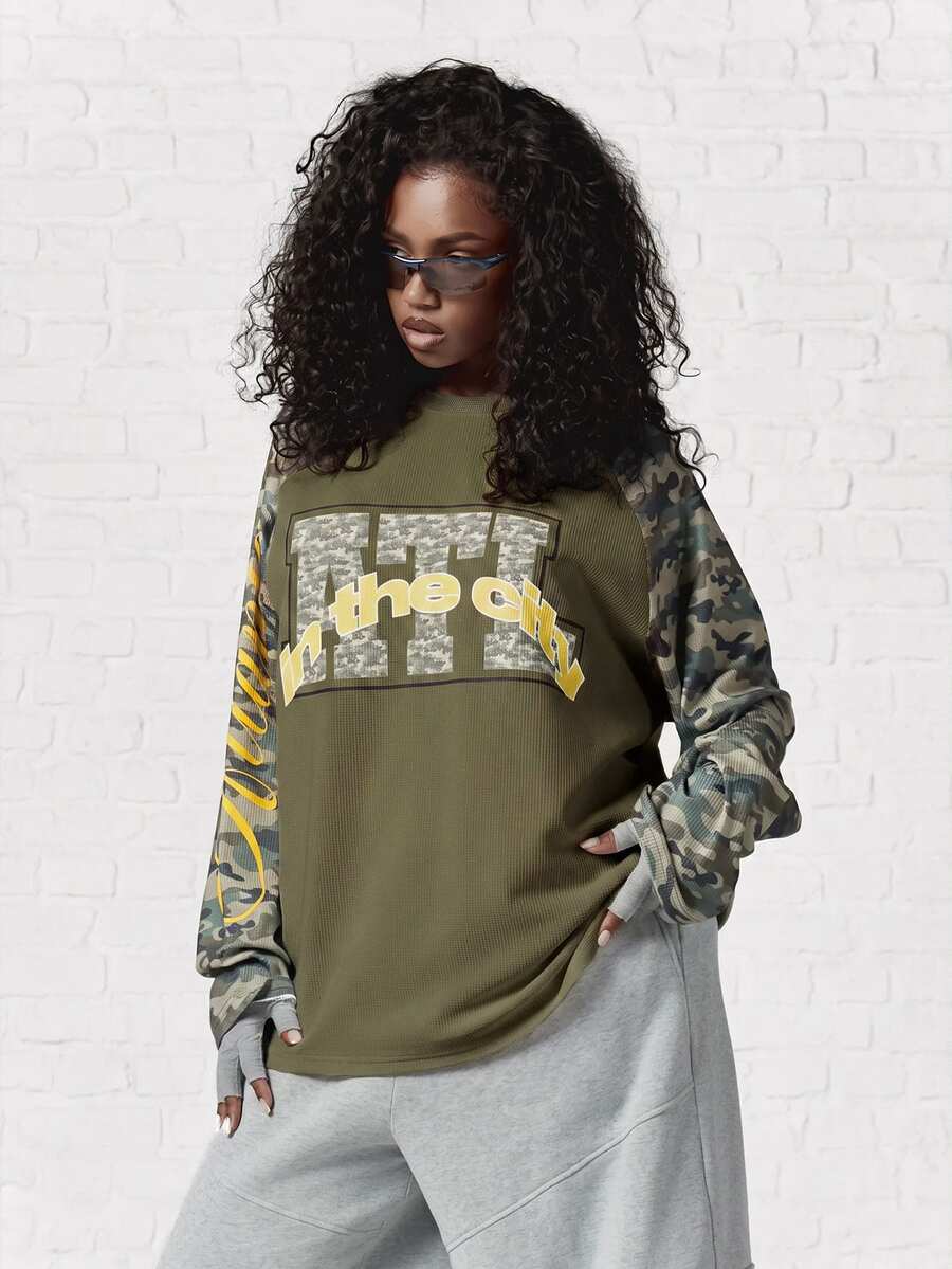 SUMWON WOMEN Oversized Waffle Knit Long Sleeve Top With Camo Raglan Sleeves And Graphic Text Print Front - Khaki - View 1