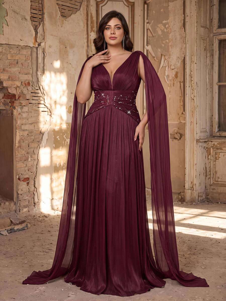 Aureia فستان ماكسي أنيق وعصري فاخر باللون العنابي، بياقة V عميقة، وأشرطة طويلة مزدوجة على الكتفين، وخصر متوسط، وتصميم مطوي مقسم بقصة A-Line، مناسب للحفلات الراقصة والزفاف وحفلات العزوبية والسهرات الرسمية (بأسلوب حرفي دقيق)