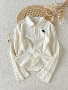 SHEIN 青少年女孩休閒百搭極簡風襯衫，胸前黑色騎士圖案，圓弧下擺設計，適合外出、購物、上學、通勤、旅行，可搭配夾克、大衣、長褲、長袖上衣 - 白色 - 查看 8