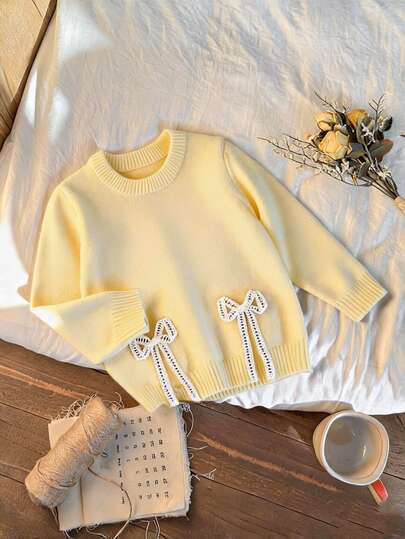 Genkimix Kids Autumn/Winter Girls' Minimalist Knitted Sweater Top, Split Hem + Bow Decor Design, Simple And Elegant Children's Round Neck Pullover Sweater, Suitable For Daily Outings, Play, Sports And Casual Wear