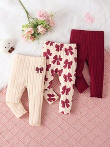 SHEIN Vintaside Kids مجموعة 3 قطع بنطلون ليقنز مضلع للبنات الرضع، بتصميم حلو وجميل، لون مشمشي وبورغندي، بطبعة فيونكة، خصر مطاطي، مناسبة لعيد الميلاد والحفلات والعطلات والخريف - متعدد الألوان - مشاهدة 3