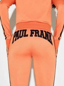 SUMWON X PAUL FRANK SUMWON WOMEN Winter Essentials California Flared Jogger Pants With Bold Logo Applique Back Print And Contrast Side Stripe Detail Autumn Warm Cozy - Orange - View 7
