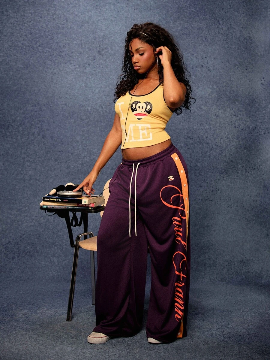 SUMWON X PAUL FRANK SUMWON WOMEN Monkey Wide Leg Jogger Pants With Cursive Logo Leg Print And Contrast Side Stripe Perfect For Spring Street Style - Purple - View 1