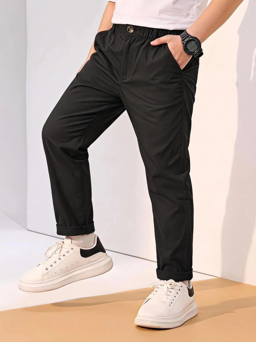 SHEIN 年轻男孩休闲舒适纯色裤子，一粒扣装饰和对角口袋，松紧腰带设计，适合日常穿着、旅行、派对、度假、时尚搭配